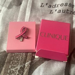 Clinique cute little breast cancer pin.